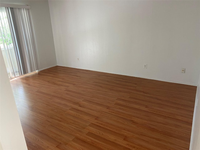 5607 Harvest Hill Rd Unit 2008, Dallas, TX 75230 - unfurnished room featuring wood finished floors