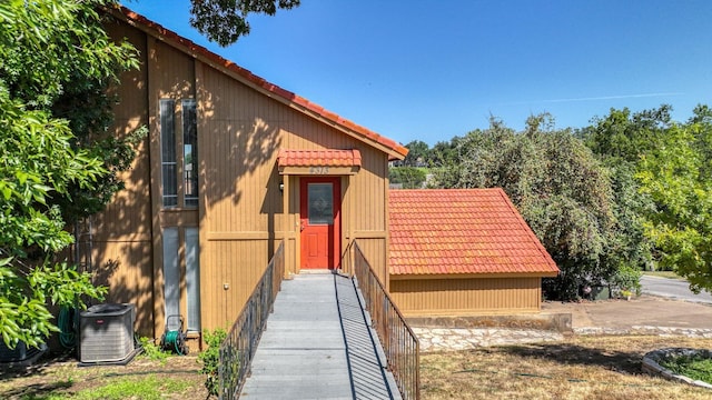 4313 Crescent Dr Unit 5, Granbury, TX 76049 - view of front of house featuring central AC unit and a tile roof