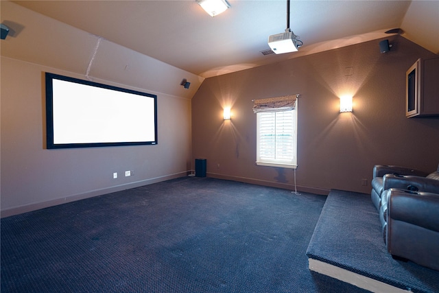 523 Buffalo Bend Ct, Murphy, TX 75094 - carpeted home theater room with vaulted ceiling and baseboards