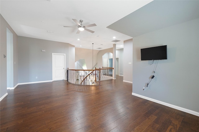 523 Buffalo Bend Ct, Murphy, TX 75094 - unfurnished room featuring a ceiling fan, baseboards, dark wood-style flooring, recessed lighting, and arched walkways