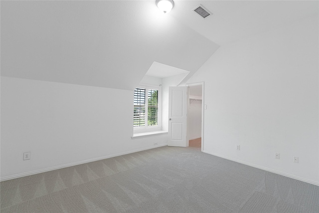 523 Buffalo Bend Ct, Murphy, TX 75094 - additional living space with lofted ceiling, carpet floors, and baseboards