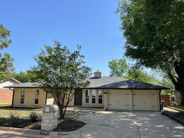 single story home featuring a garage, fence, driveway, and brick siding