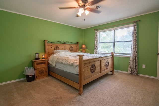 503 W College St, Rising Star, TX 76471 - bedroom with baseboards, light carpet, crown molding, and visible vents