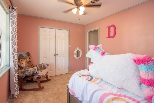503 W College St, Rising Star, TX 76471 - bedroom featuring a closet, baseboards, a ceiling fan, crown molding, and carpet flooring