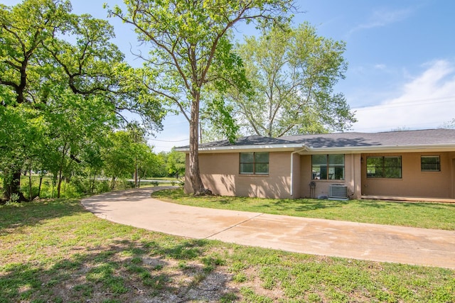503 W College St, Rising Star, TX 76471 - exterior space featuring a yard, driveway, and central AC unit