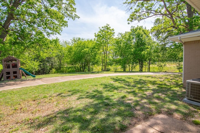 503 W College St, Rising Star, TX 76471 - view of yard with central AC and a playground