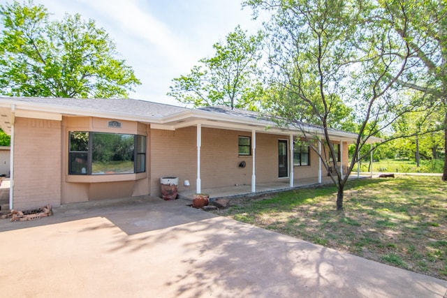 503 W College St, Rising Star, TX 76471 - ranch-style home featuring a front yard and brick siding