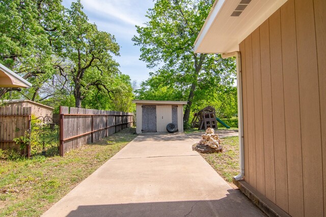 503 W College St, Rising Star, TX 76471 - view of yard featuring a storage shed, fence, and an outdoor structure