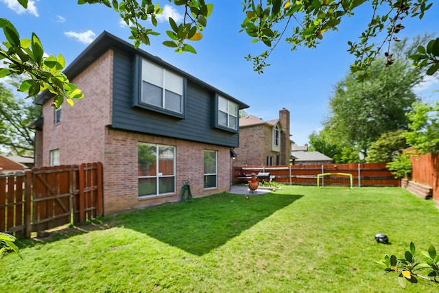 2313 Suntree, Flower Mound, TX 75022 - rear view of property featuring brick siding and a patio area