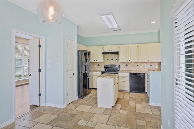 2313 Suntree, Flower Mound, TX 75022 - kitchen with black appliances, under cabinet range hood, stone tile floors, ornamental molding, and backsplash