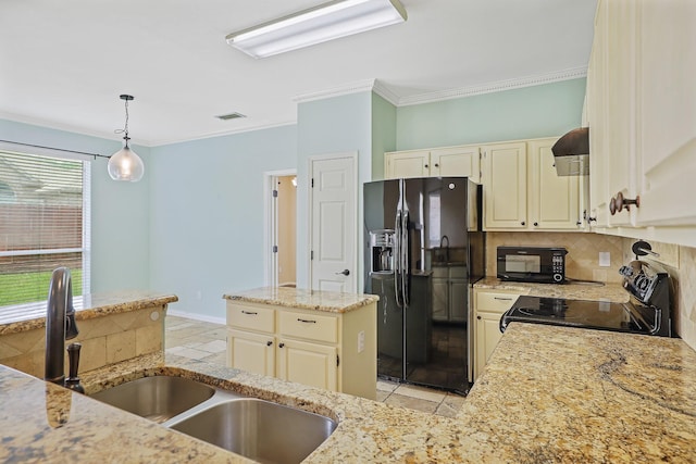 2313 Suntree, Flower Mound, TX 75022 - kitchen with black appliances, a sink, light stone counters, cream cabinetry, and decorative backsplash