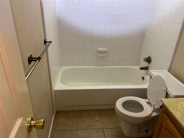 bathroom with tile patterned floors, vanity, toilet, and tub / shower combination