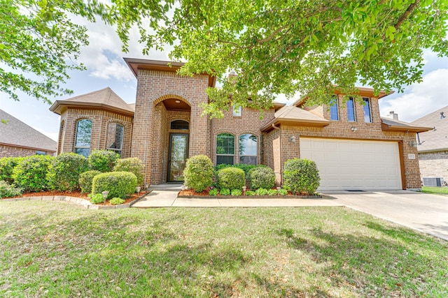 109 Thoroughbred St, Waxahachie, TX 75165 - view of front of house featuring a front yard, central AC unit, a garage, concrete driveway, and brick siding