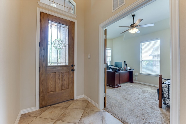 109 Thoroughbred St, Waxahachie, TX 75165 - foyer entrance with visible vents, baseboards, a ceiling fan, light tile patterned flooring, and light carpet
