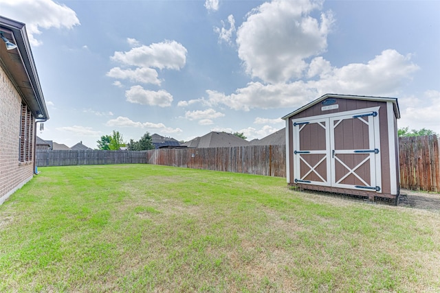 109 Thoroughbred St, Waxahachie, TX 75165 - view of yard featuring a storage unit, a fenced backyard, and an outdoor structure