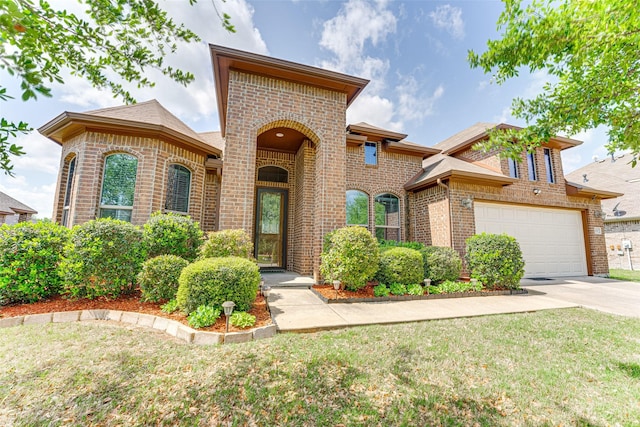109 Thoroughbred St, Waxahachie, TX 75165 - mediterranean / spanish house featuring an attached garage, driveway, a front yard, and brick siding