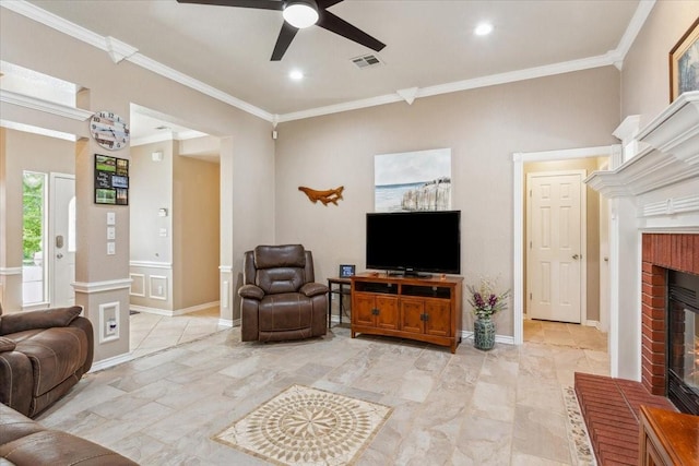 living room with baseboards, ornamental molding, ceiling fan, a fireplace, and recessed lighting