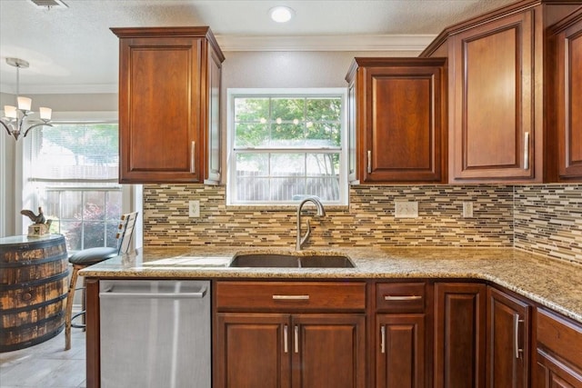 kitchen featuring dishwasher, ornamental molding, a sink, and backsplash