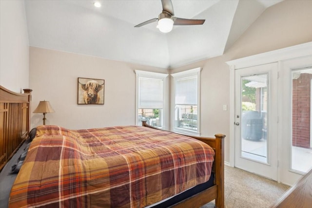 carpeted bedroom featuring access to outside, vaulted ceiling, and a ceiling fan