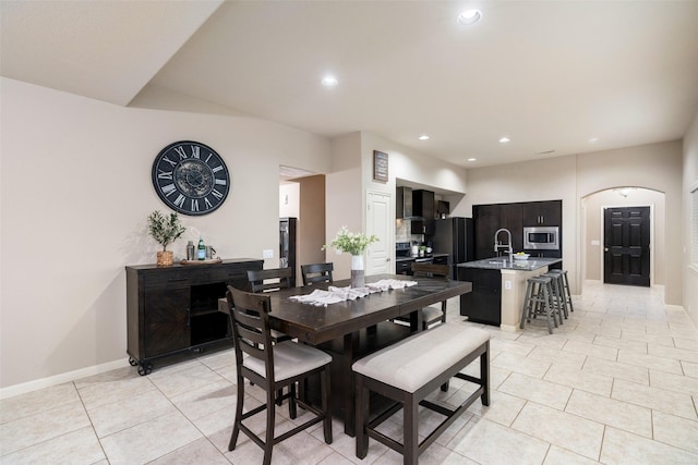 500 Harding Ln, Lavon, TX 75166 - dining room with light tile patterned flooring, recessed lighting, arched walkways, and baseboards