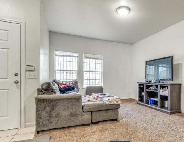 carpeted living room with baseboards