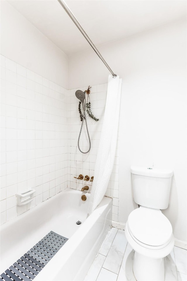bathroom with shower / tub combo, marble finish floor, baseboards, and toilet