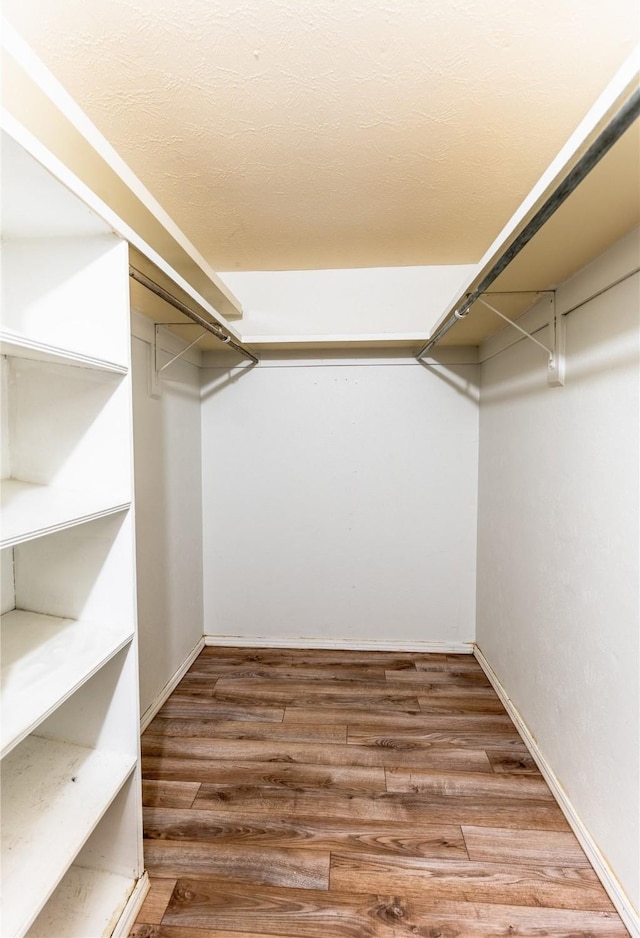 spacious closet with wood finished floors