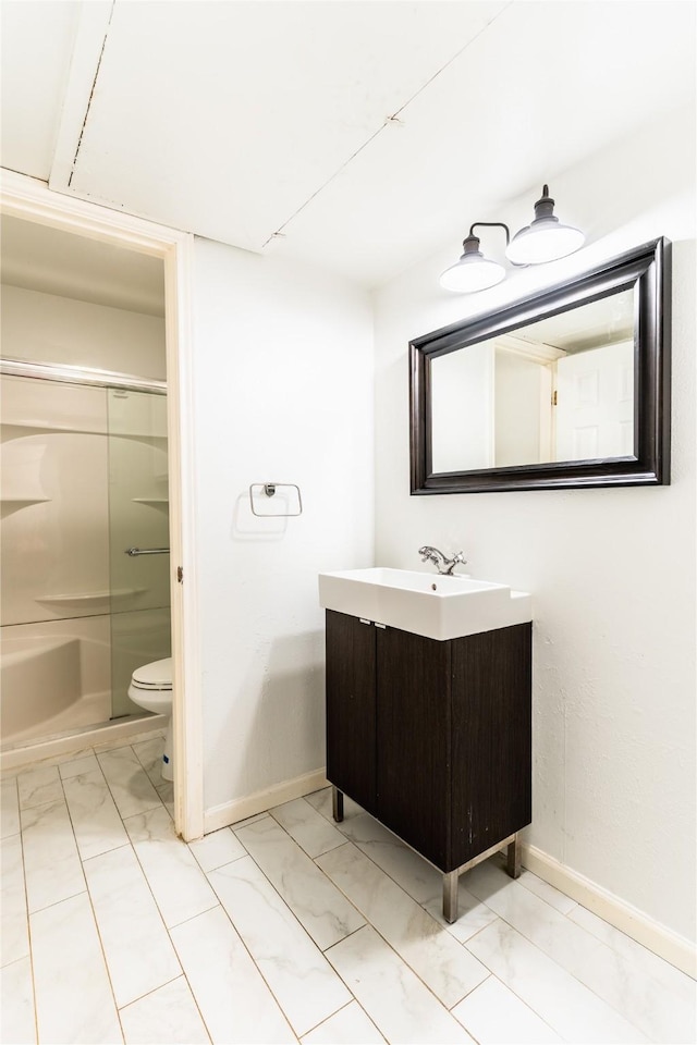 full bathroom with walk in shower, baseboards, toilet, vanity, and marble finish floor