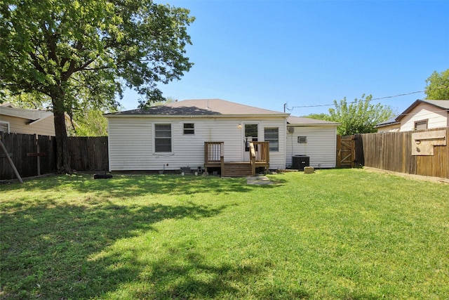 120 N Las Vegas Trl, White Settlement, TX 76108 - rear view of property featuring a deck, a fenced backyard, central AC, and a lawn