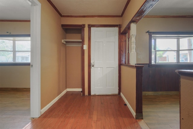 120 N Las Vegas Trl, White Settlement, TX 76108 - hallway featuring wood finished floors, ornamental molding, and a wealth of natural light