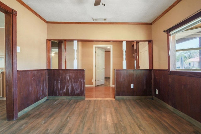 120 N Las Vegas Trl, White Settlement, TX 76108 - spare room with visible vents, ornamental molding, ceiling fan, wainscoting, and wood finished floors