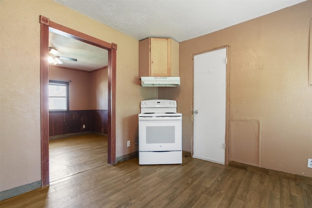 120 N Las Vegas Trl, White Settlement, TX 76108 - kitchen with baseboards, white electric stove, under cabinet range hood, light brown cabinetry, and wood finished floors