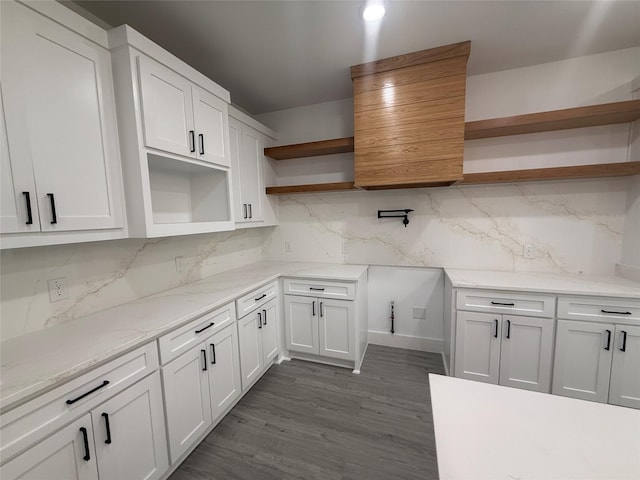 kitchen featuring light stone counters, decorative backsplash, open shelves, and white cabinets