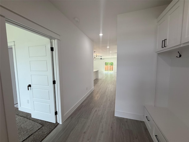 mudroom with baseboards, dark wood-style floors, and recessed lighting