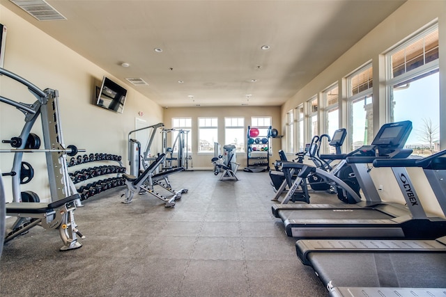 workout area featuring recessed lighting and visible vents
