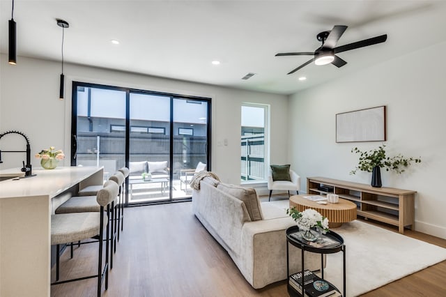 7312 Flyers Way, Dallas, TX 75235 - bedroom with baseboards, wood finished floors, recessed lighting, ensuite bathroom, and a ceiling fan