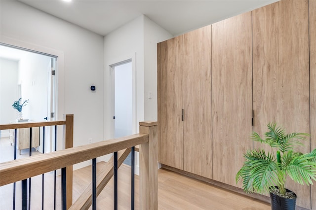 7312 Flyers Way, Dallas, TX 75235 - hallway featuring an upstairs landing and light wood finished floors