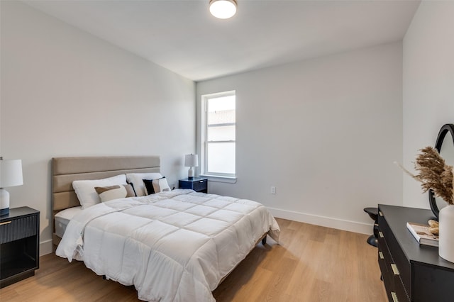 7312 Flyers Way, Dallas, TX 75235 - bedroom with wood finished floors and baseboards