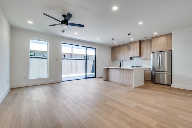 7312 Flyers Way, Dallas, TX 75235 - kitchen featuring appliances with stainless steel finishes, modern cabinets, light countertops, open floor plan, and recessed lighting