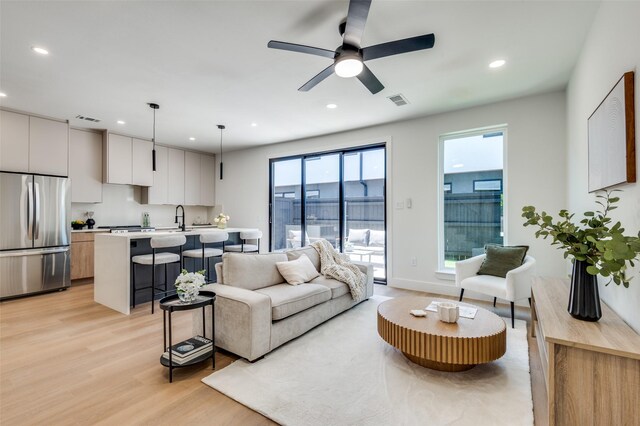7312 Flyers Way, Dallas, TX 75235 - living area featuring light wood-type flooring, recessed lighting, and ceiling fan