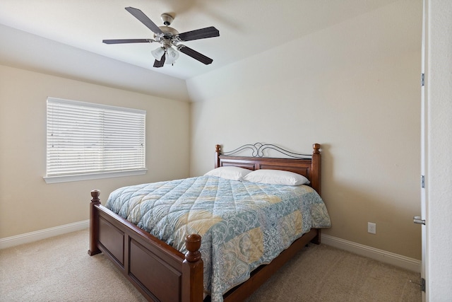 bedroom with baseboards, a ceiling fan, and light carpet