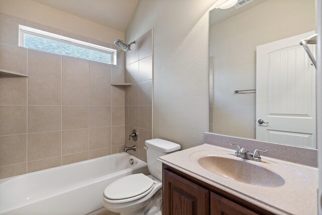 bathroom with vanity, visible vents, shower / bathing tub combination, and toilet