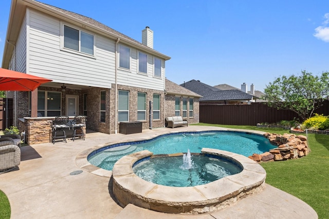 view of pool featuring a fenced backyard, a yard, a patio area, ceiling fan, and a pool with connected hot tub