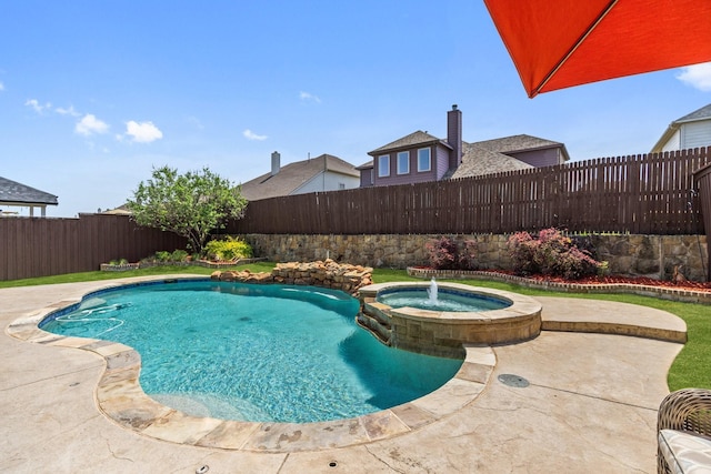 view of pool with a fenced backyard, a patio, and a pool with connected hot tub