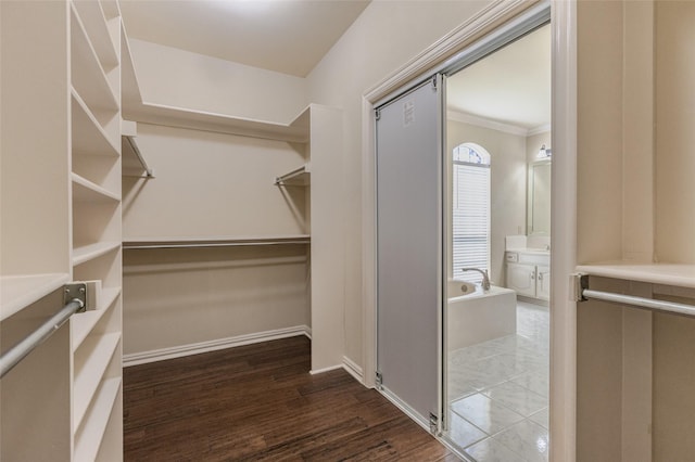 spacious closet with wood finished floors