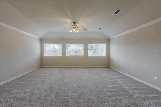 empty room featuring carpet, visible vents, ceiling fan, and vaulted ceiling