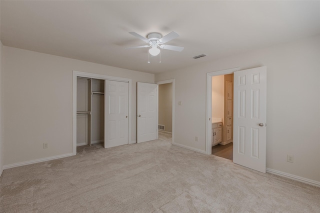 unfurnished bedroom with visible vents, baseboards, carpet flooring, and a closet
