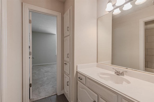 bathroom featuring vanity and baseboards