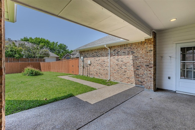 view of yard with fence and a patio area