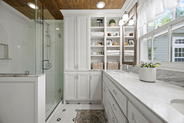 full bathroom with tile patterned flooring, double vanity, wooden ceiling, a sink, and a stall shower
